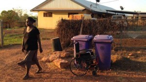 Dianne, leaves her wheel chair at the bins ready for the rubbish.